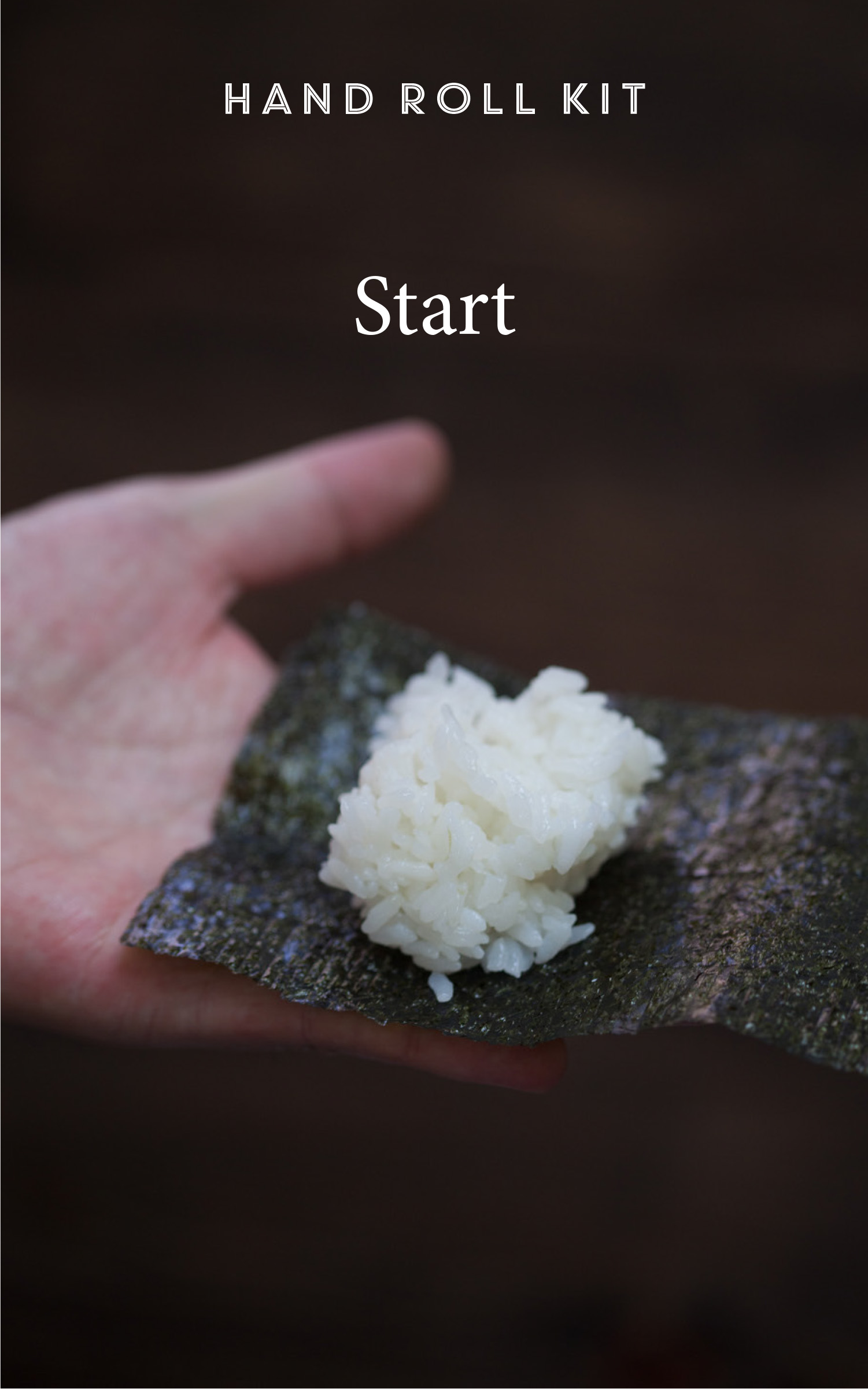 Photo of hand holding nori with rice on top